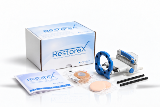 RestoreX penile traction device with branded box, instruction booklet, and accessories on a white background.